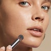 Model Using Domed Concealer Brush
